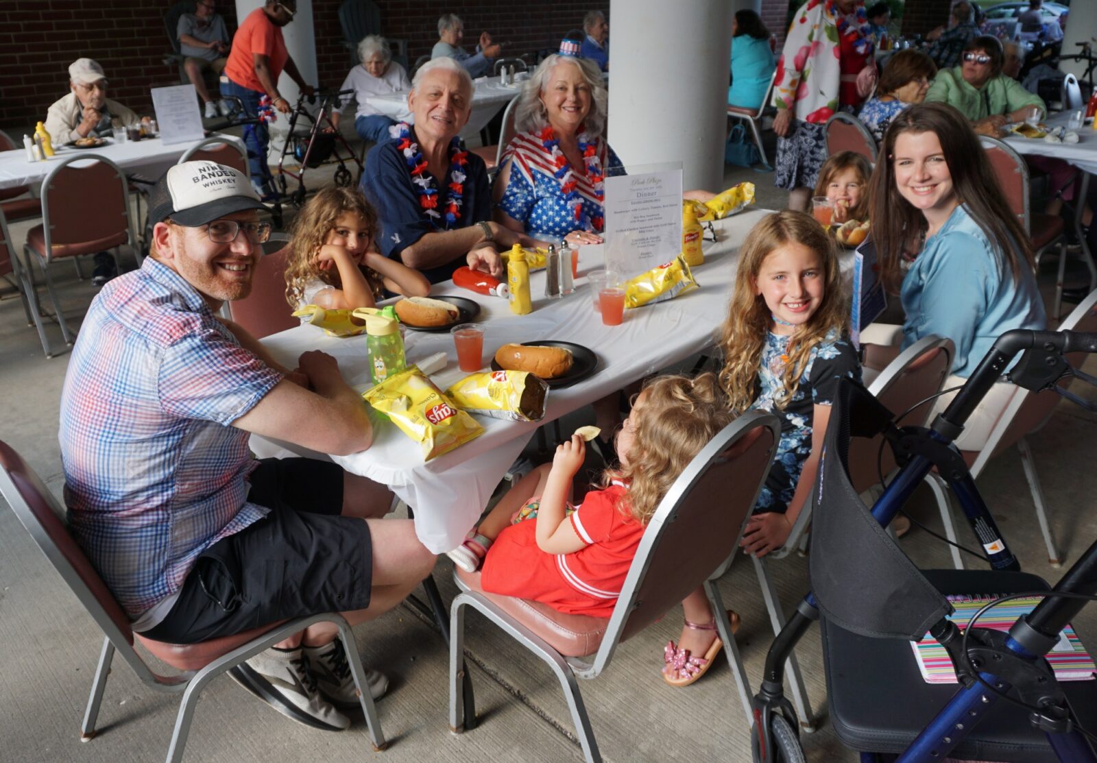 Family gathering with food, smiles, and festive atmosphere.